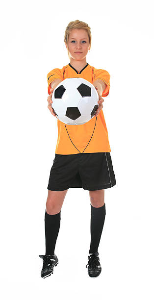 istock Yellow Soccer Player Holding Ball 155099012