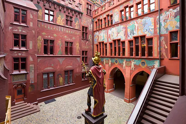 The ornate courtyard of the Basel town hall with the statue of Lucius Munatius Plancus (87-15 BC), founder of Basel, Switzerland