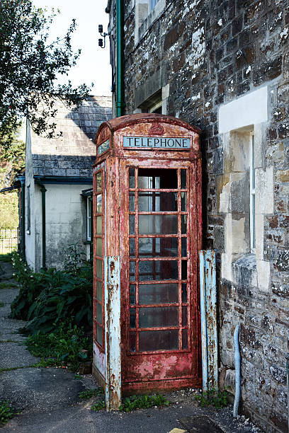 istock Weathered and battered red telephone box 155099523