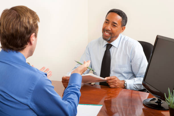 istock Two businessmen having a business meeting 155099615
