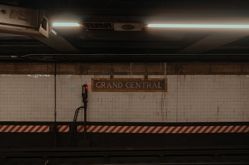 London, UK - 12 19 2017: Mind the Gap warning sign on a underground platform at a London Underground Station