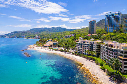 Garza Blanca Beach in Puerto Vallarta is a stunning coastal retreat with golden sands, turquoise waters, and a tranquil atmosphere, perfect for relaxation and enjoying the beauty of nature.