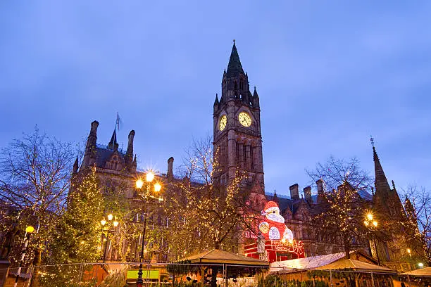 Christmas Market on Albert Square in front of the Town Hall, Manchester, England.