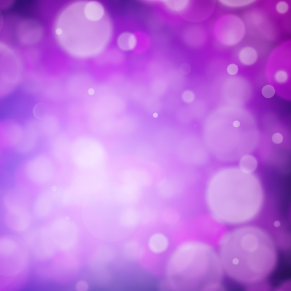 Symbol of defocused lights over pink and purple shades.