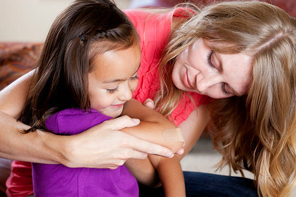 Mother Helping her Daughter  medicate stock pictures, royalty-free photos & images