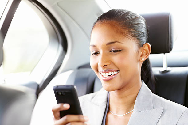 istock Businesswoman Texting in a Car 155100328