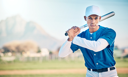 Portrait, baseball and mockup with a sports black man outdoor on a field standing ready to play a competitive game. Fitness, exercise and training with a serious male athlete outside in a stadium
