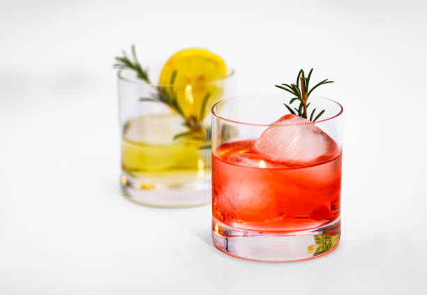 istock Two fresh cocktails with ice isolated in the studio 1551026039