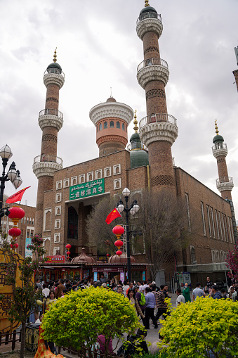 Urumqi, Xinjiang, China-april 30, 2023: Xinjiang International Grand Bazaar in Urumqi is the biggest bazaar in the China. Bazaar refers to a market or fair in Arabic. It is strong in Islamic architecture style on the basis of the prosperity of the ancient Silk Road, reflected on the rich western ethnic features and regional culture. Combining traveling, nation trade, restaurant, ethnic art display and retailing together, it is a scenic spot in the Erdaoqiao business circle.
