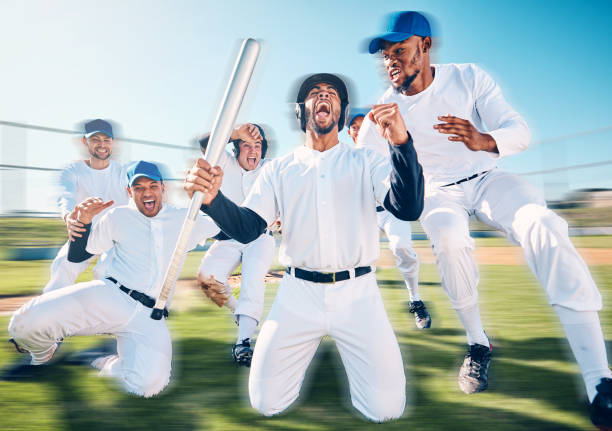 istock Teamwork, sports and winner with baseball player on field for home run, training and strike. Fitness, happy and celebration with group of men in park stadium for achievement, friends and action 1551042379