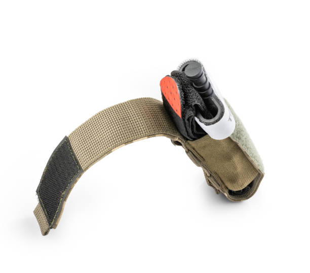 istock Open military tactical pouch with tourniquet inside. First aid tool for bleeding 1551052419