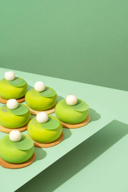 istock A tray of various green donuts on top of a table 1551066549