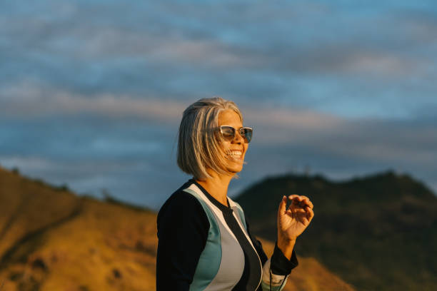 istock Smiling senior woman on the valley walk 1551081121