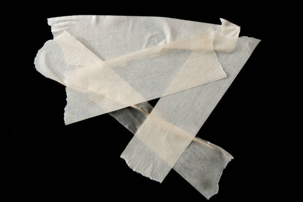 istock adhesive paper , masking tape isolated on black background 1551090197