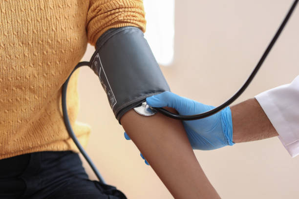 istock Measuring blood pressure at doctor's office 1551101937