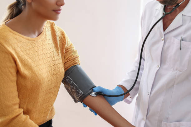 istock Measuring blood pressure at doctor's office 1551102979
