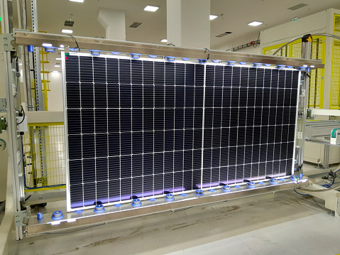 Photovoltaic panels in front of city background