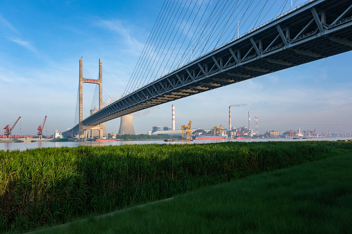 Taking the Yokohama Bay Bridge under the blue sky from the hills park with a view of the sea