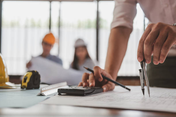 use compasses pencil to measurement for create architecture building blueprint. behind has engineer. - strategy plan architecture mathematical symbol imagens e fotografias de stock