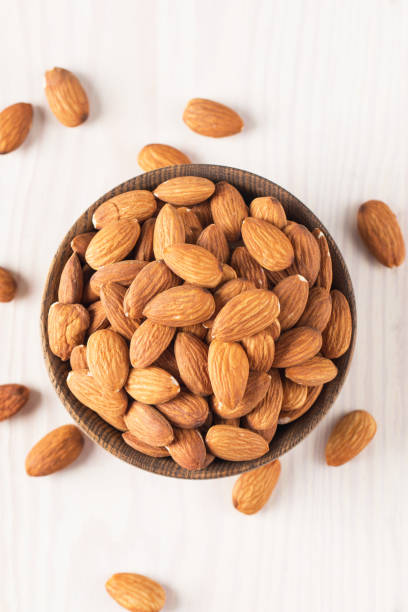 istock Raw peeled almonds in brown bowl 1551210343