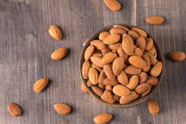 istock Raw peeled almonds in brown bowl 1551210354