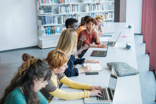 istock Group of college students studying at university - focus on young asian man 1551211799