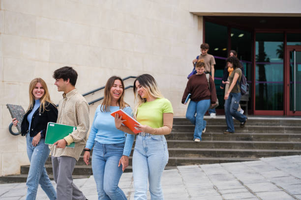 istock Group of students leaving the university library 1551212486