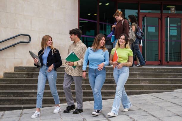 istock Group of students leaving the university library 1551214090
