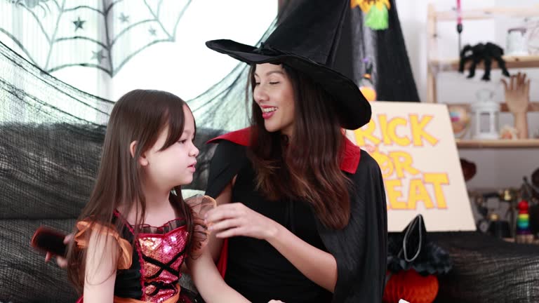 Family Fun Halloween - Joyful Mother and Child Enjoy Spooky Halloween Party at Home