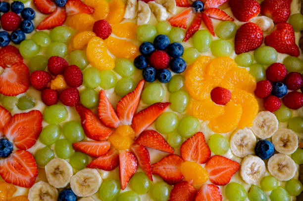 istock Cake topped with various fruits. 1551244385