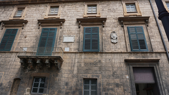 Old facade of historical building in Palermo at Italy