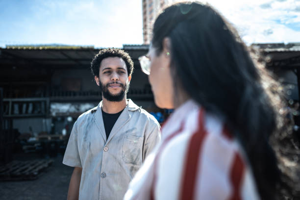 istock Young man talking to a manager on a industry 1551247021