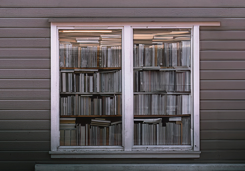 old wooden window with books in the city