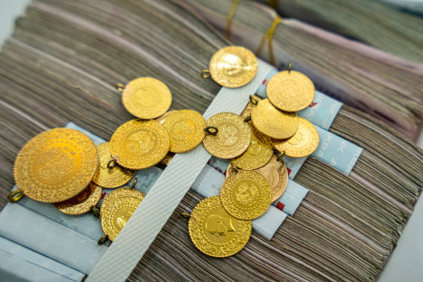 istock Gram gold coins and money stacks 1551259513