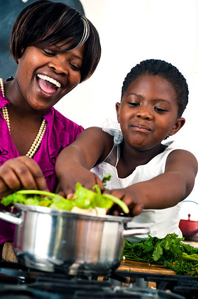 istock Mother and daugter cooking 155126047