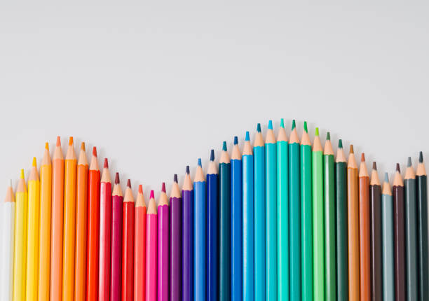 istock Back to school! Creative layout made of colored pencils on white background. Minimal colored pencils concept. Trendy flat lay school idea. Top of view. Copy space. 1551268998