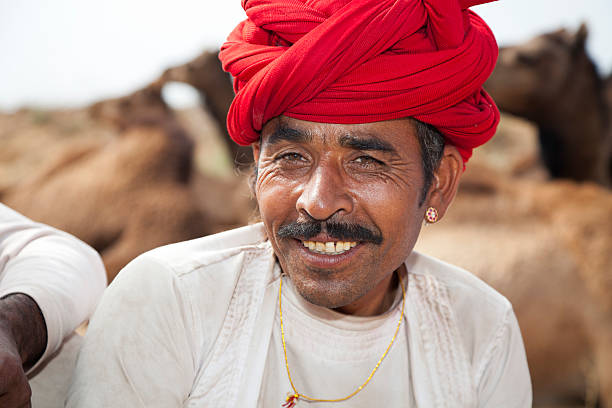 istock Smiling Camel Trader At The Pushkar Fair 155128883