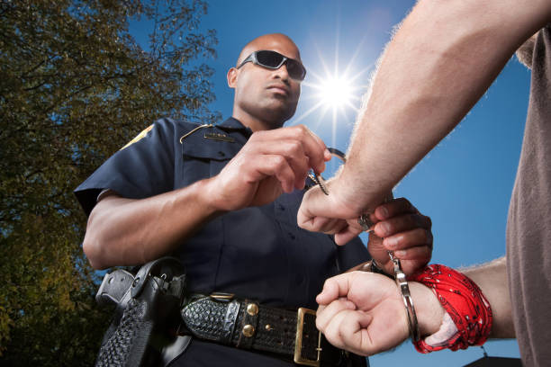 Top view of prisoner's hands in handcuffs. Verdict at the court.