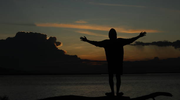 istock silhouette of man on the lake 1551301679