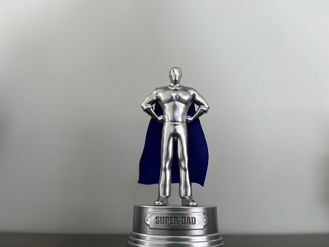 The close up, isolated image of a trophy for a super dad on father's day.