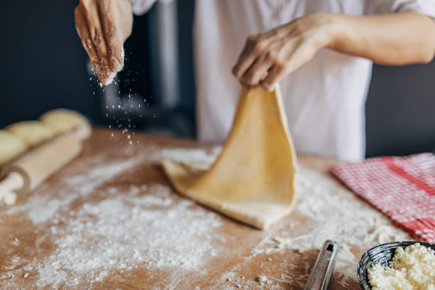 istock A woman prepares a pizza 1551307392