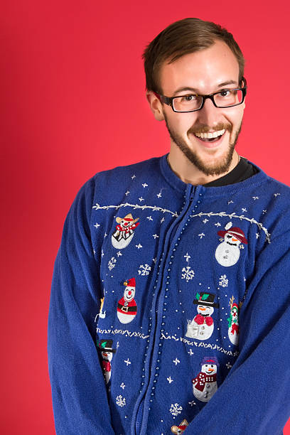 Ugly sweater geek young nerd in his ugly sweater christmas ugliness sweater nerd stock pictures, royalty-free photos & images