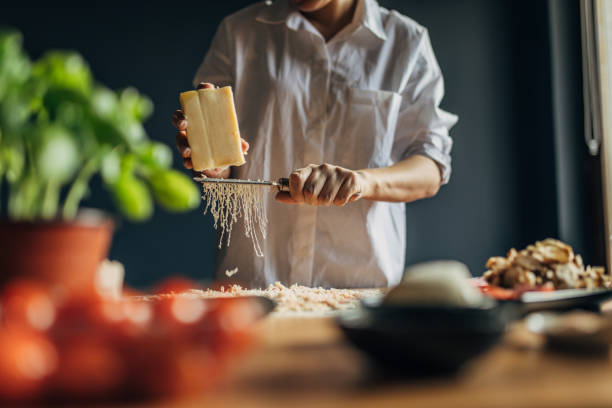 istock A woman prepares a pizza 1551314833