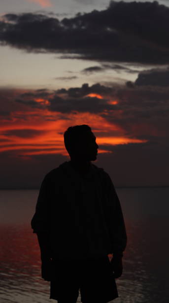 istock silhouette of man on the lake 1551316122