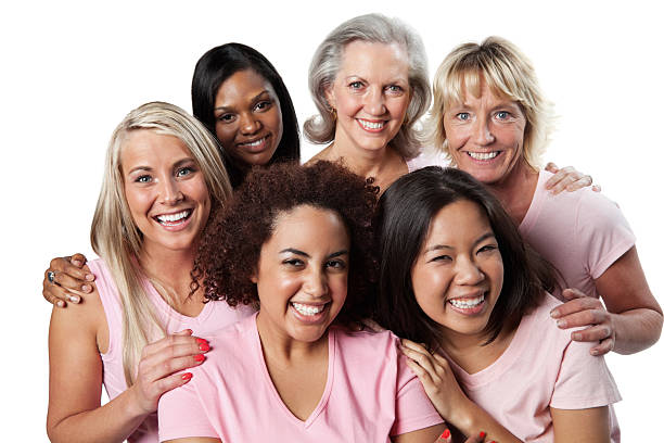 felice svariato gruppo di donne in rosa - cancer women womens issues friendship foto e immagini stock