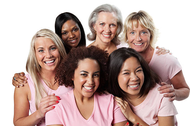 Diverse group of happy women in pink  group of women all ages stock pictures, royalty-free photos & images