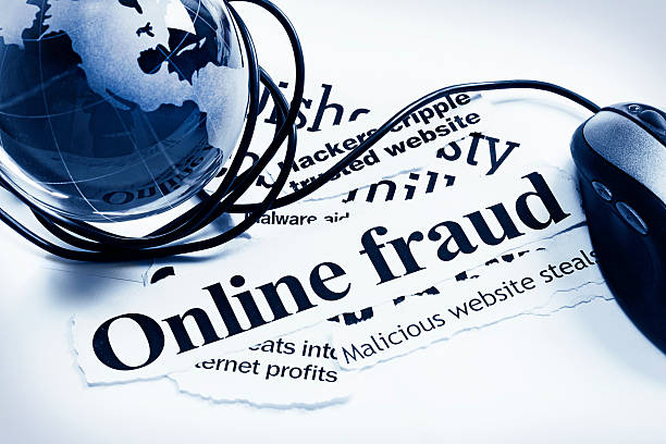 istock Glass world globe and computer mouse on Online Fraud headlines 155132055
