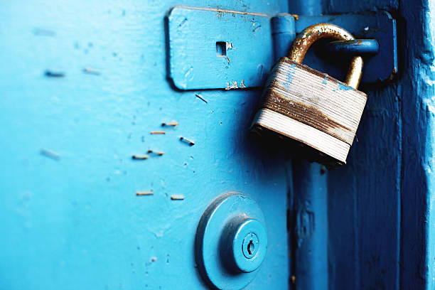 istock padlock and entry locks on blue door 155132688