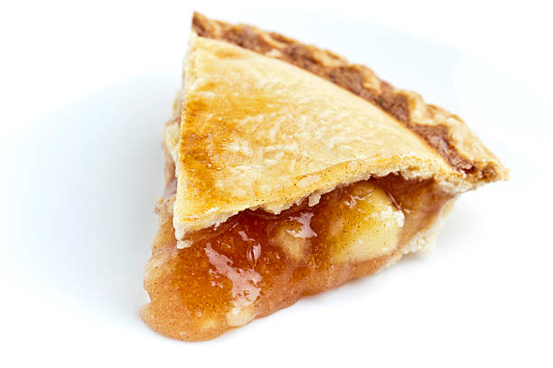 Piece of apple pie Piece of apple pie on white background apple pie photos stock pictures, royalty-free photos & images