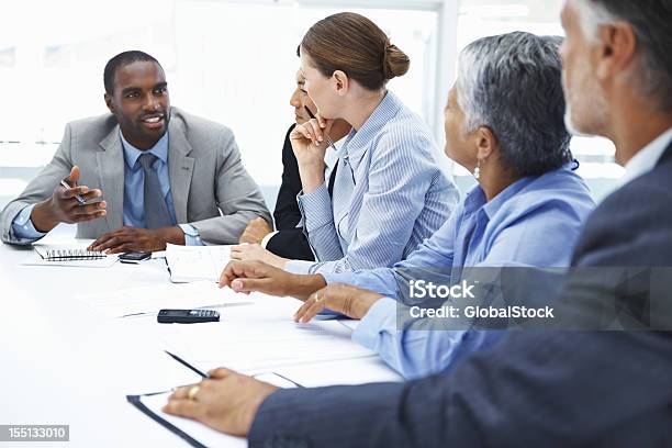 Professional Sharing Views With Business People Stock Photo - Download Image Now - 30-39 Years, Adult, Adults Only